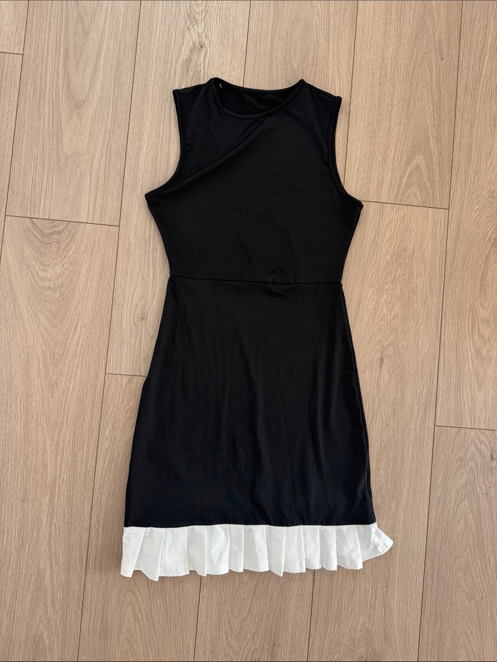 Sleeveless Black Dress with White Ruffle Hem